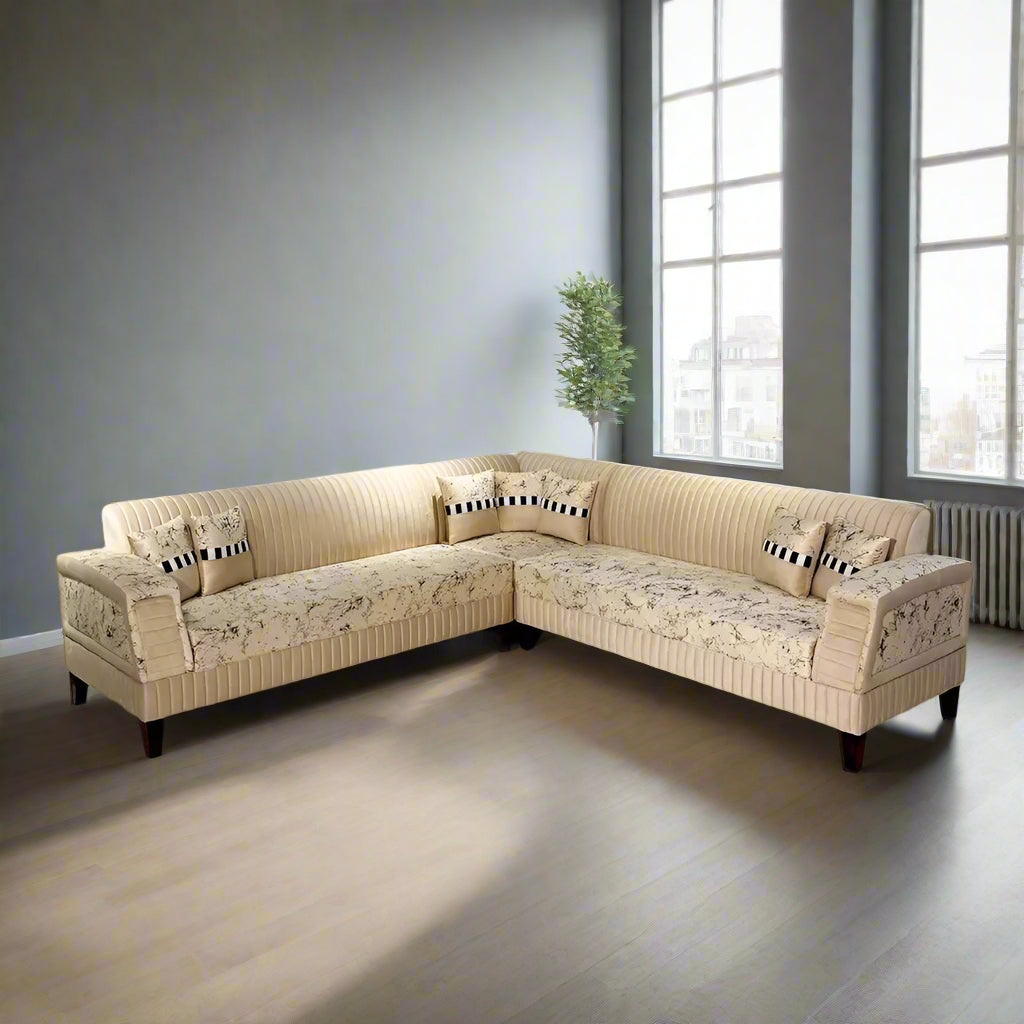Beige sectional sofa in a room with light blue walls and a marble floor.
