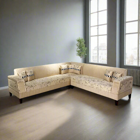 Beige sectional sofa in a room with light blue walls and a marble floor.