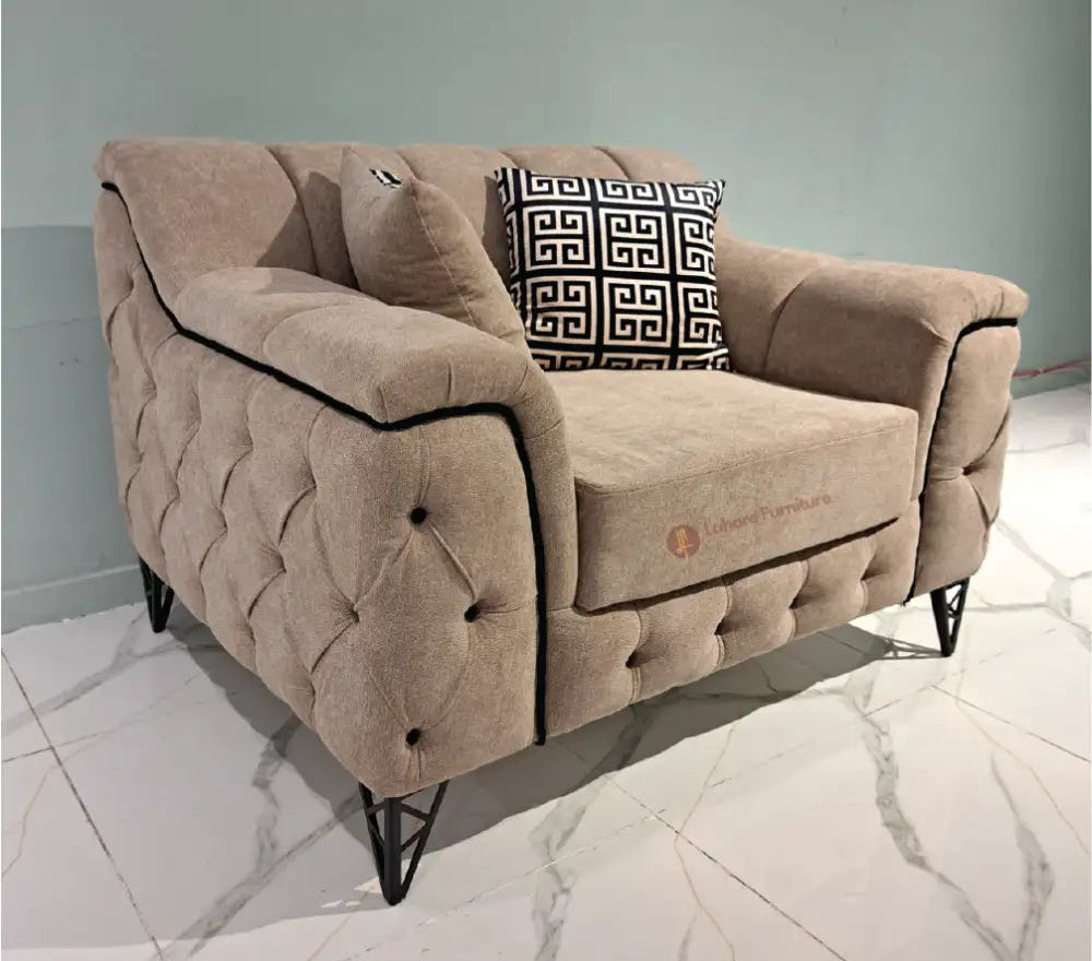 Beige sofa with a decorative pillow on a marble floor, branded 'Lahore Furniture'.