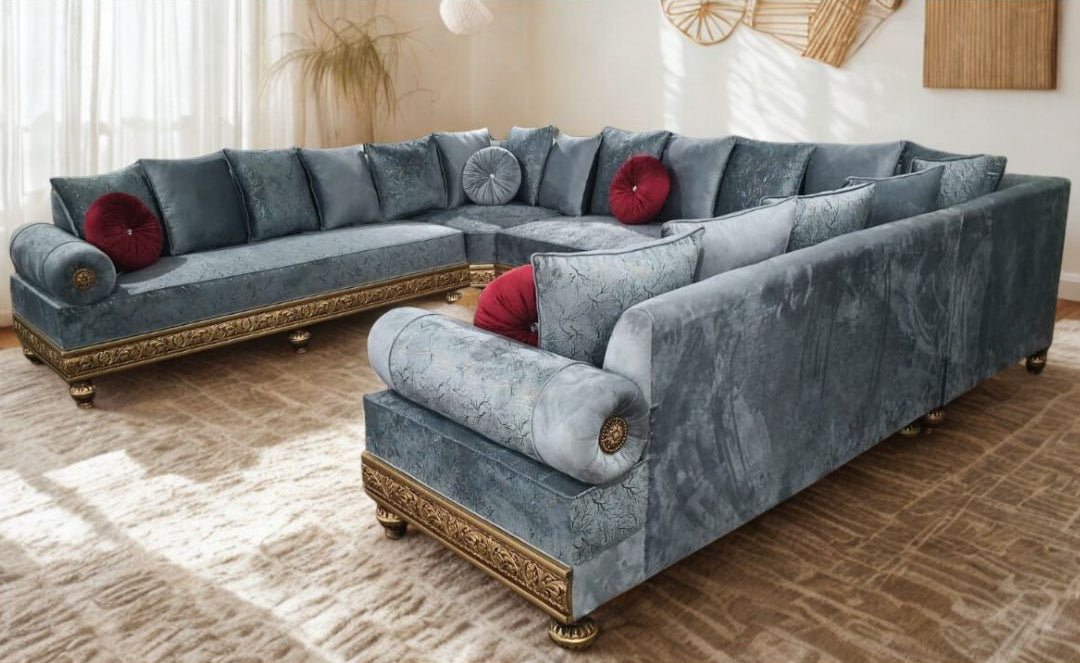 Gray sectional sofa with red cushions in a living room setting