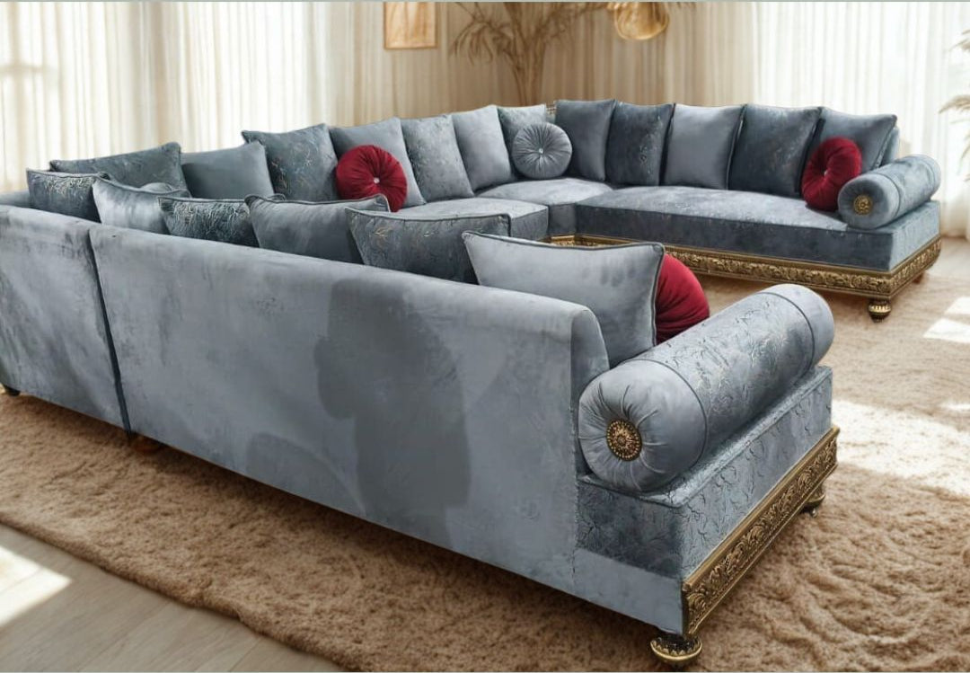 Large gray sectional sofa with decorative pillows in a living room setting.
